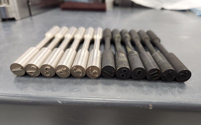 closeup photo of metal bars on desk