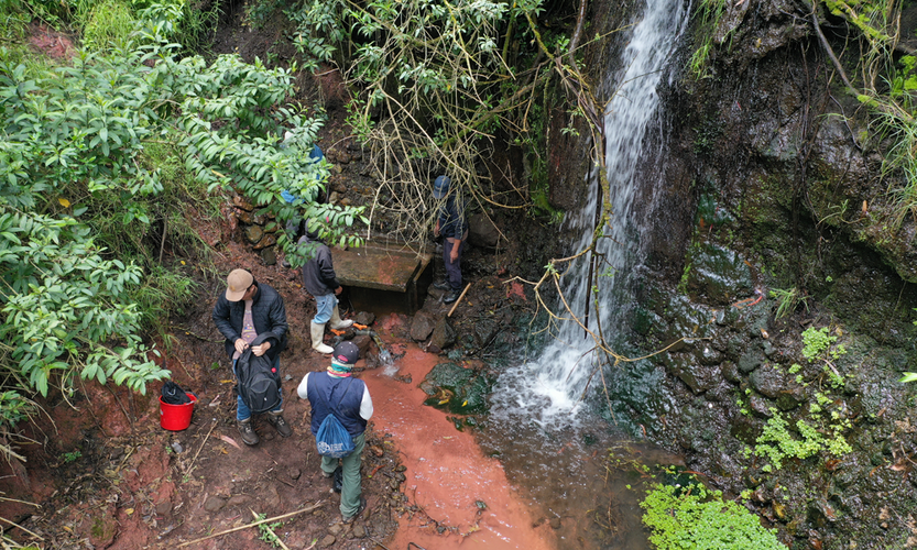 Students checing out site for building drinking water access.