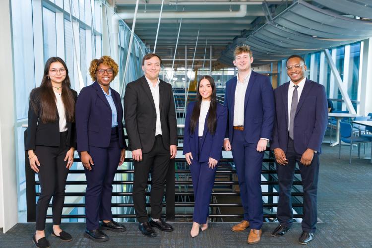 The six members of engineering senior design team 516 stand together on the third floor breezeway at the FAMU-FSU College of Engineering.