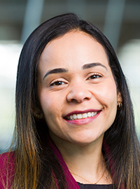 smiling woman in pink jacket