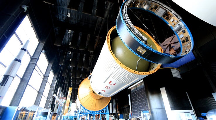 Inside NASA Space Center with spaceship hanging.