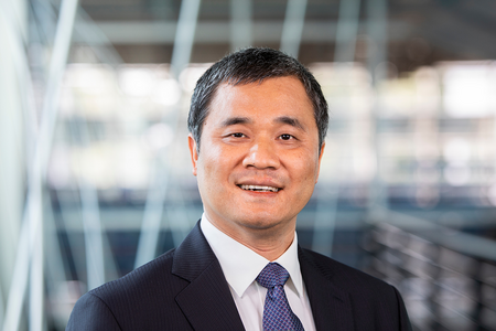 smiling man in black suit