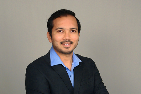 photo of man in blue shirt and black jacket