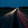 photo of car lights on highway at night blurred