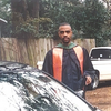 man in graduation regalia in front of car old image