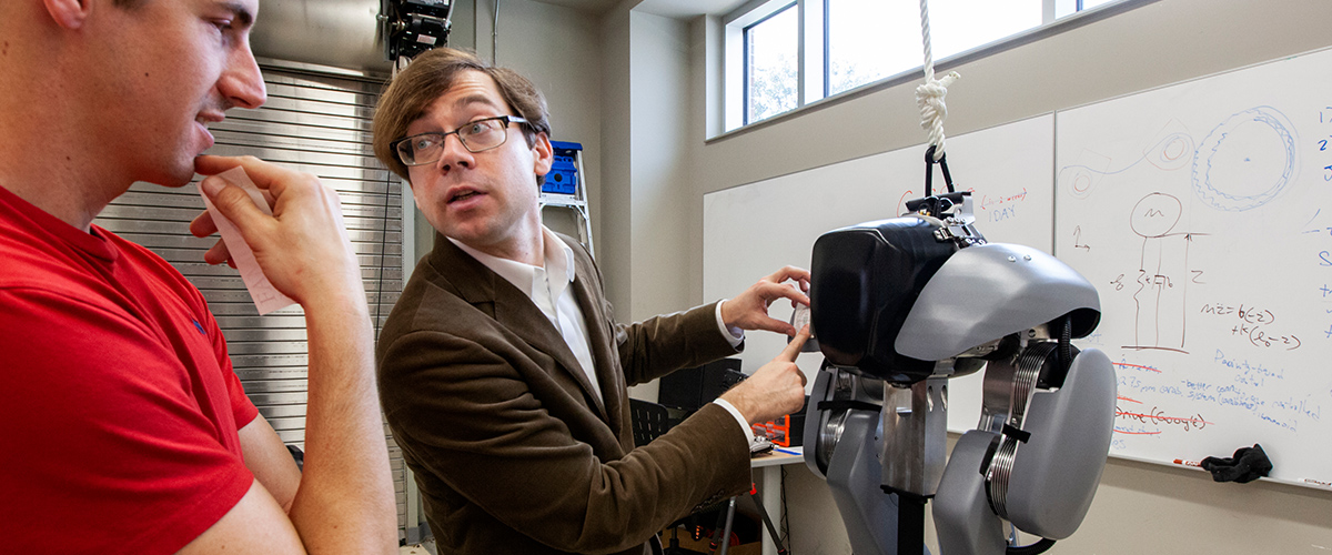 Dr. Christian Hubicki shows his bipedal robot named 