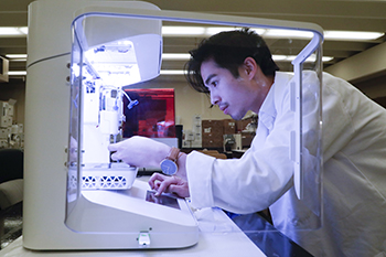 Paul Dinh sets up the Cellink Bio X bio printer 