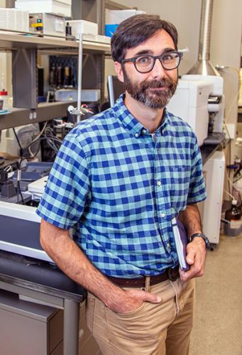 photo of chemical and biomedical engineering professor daniel hallinan in lab