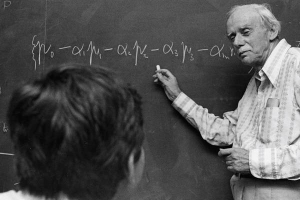 historial photo of paul dirac writing on chalk board at florida state university