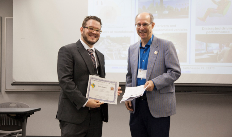 Student of the Year Award presented to Dustin Souders by major professor Neil Charness