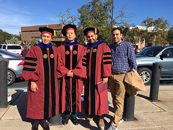 Dr. Jung and two doctoral students at hooding