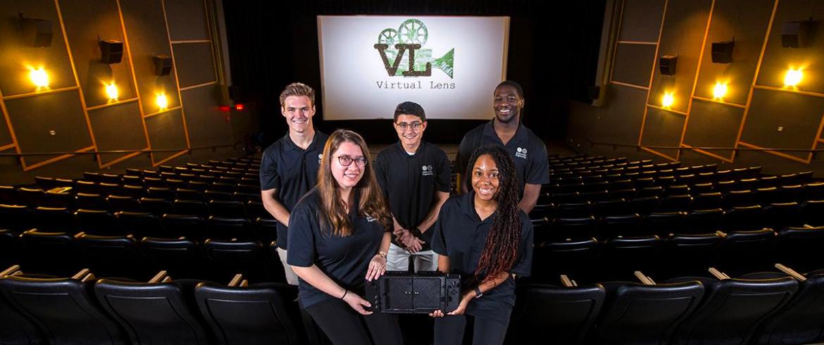 Virtual Lens Engineering Senior Design team with their prototype. The team members are: Weston Dudley, Kayla Miller, Daniella Turbessi, Kyle A. Suarez and Keishon Smith