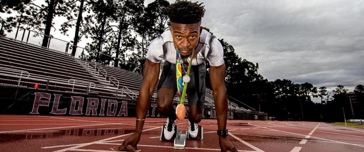 Alonzo Russell in the starting position at a track