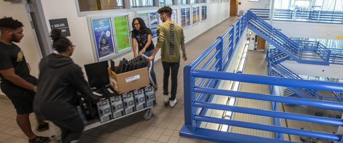 NSBE students wheel computers out of engineering college