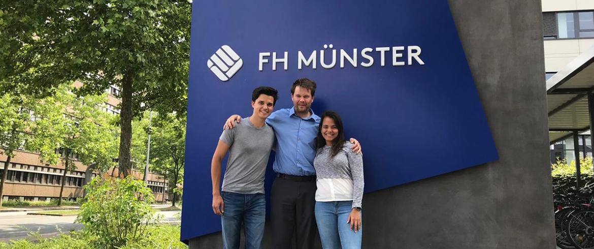 Kampmann and two students in Germany