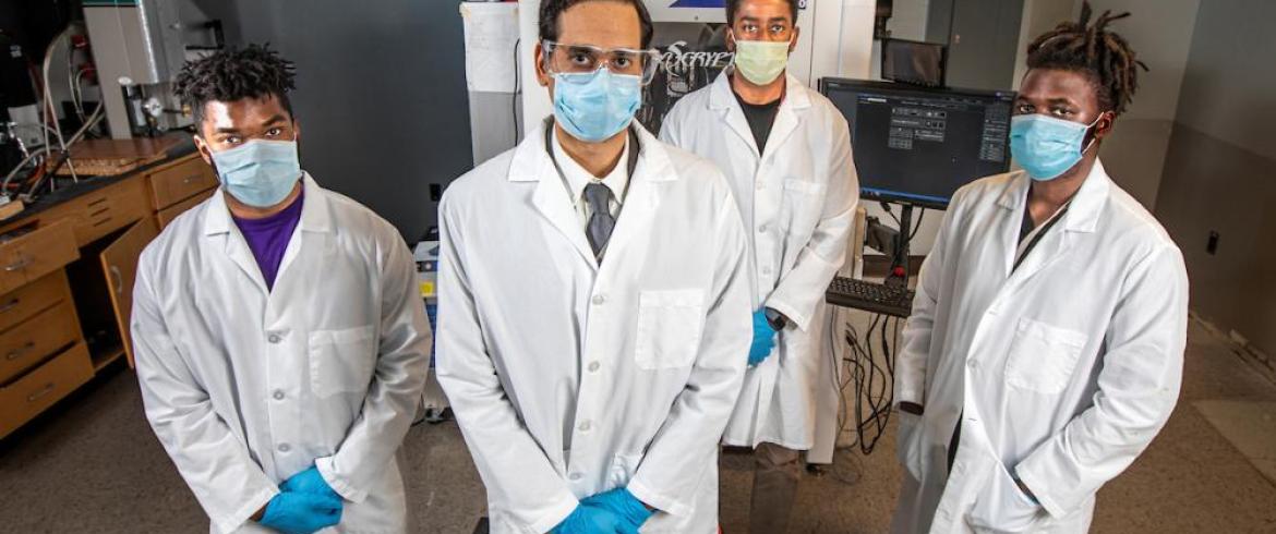 biomedical engineering faculty member jamel ali phd with students in lab