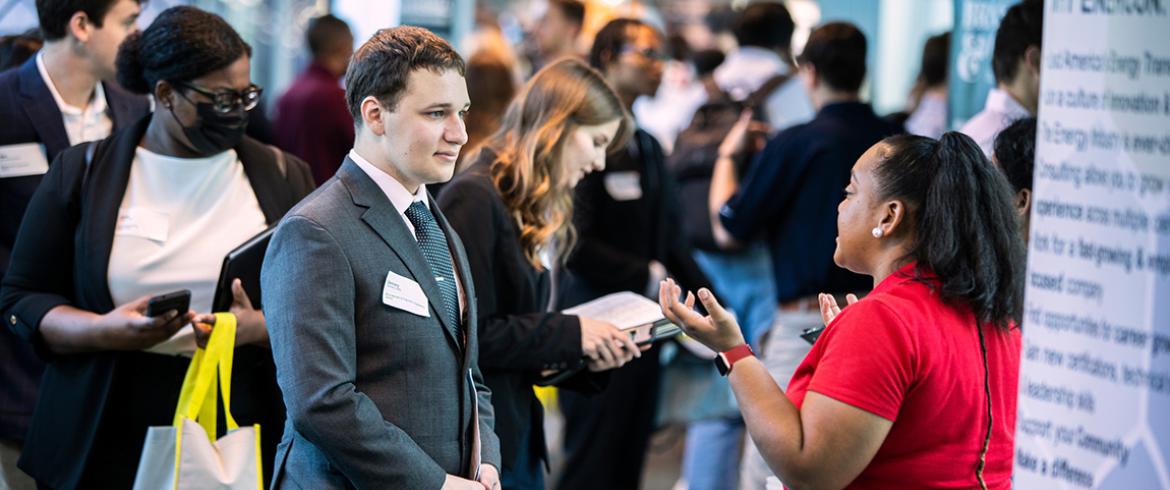 engineering student talks with corporate recruiter at the stem career fair at famu-fsu engineering