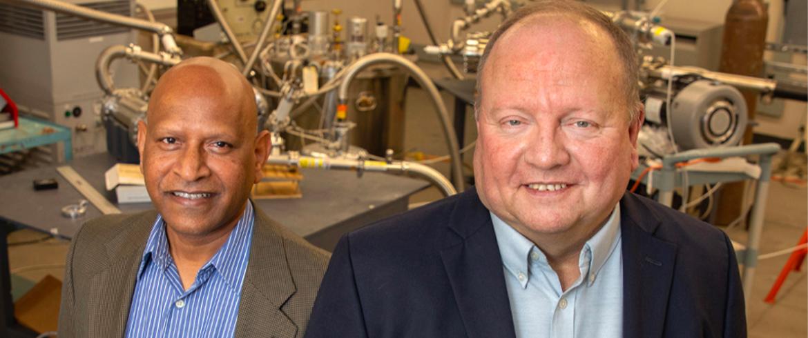 From left, Center for Advanced Power Systems Associate Director Sastry Pamidi and Director Roger McGinnis in a lab at the CAPS facility. (Bruce Palmer/FSU Photography Services)