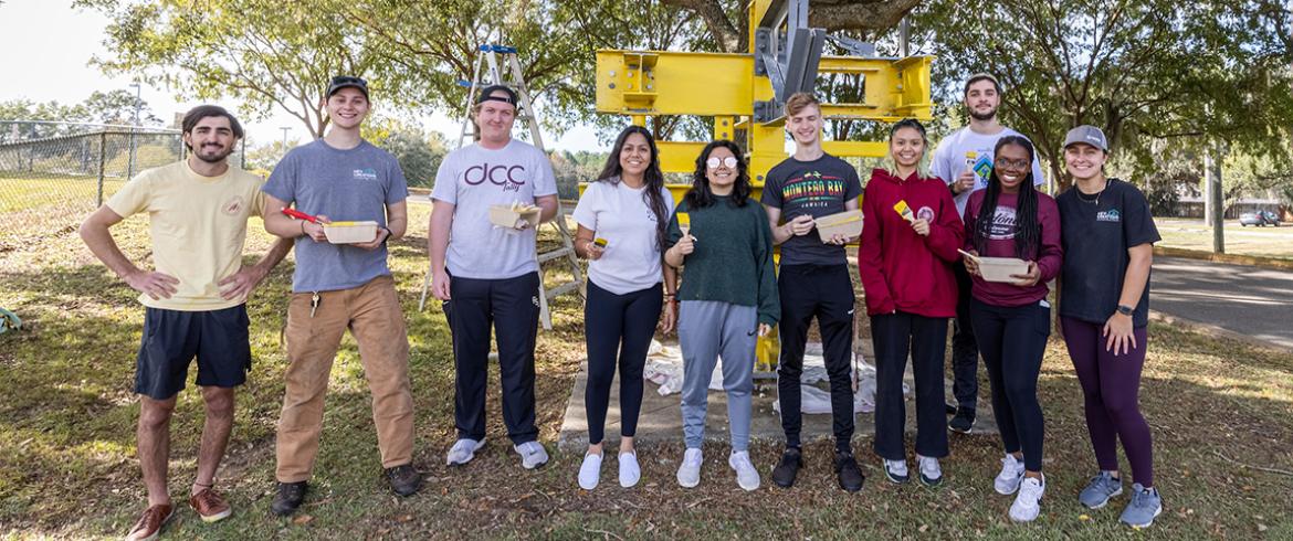 theta tau crew who refurbished the sculpture in 2022