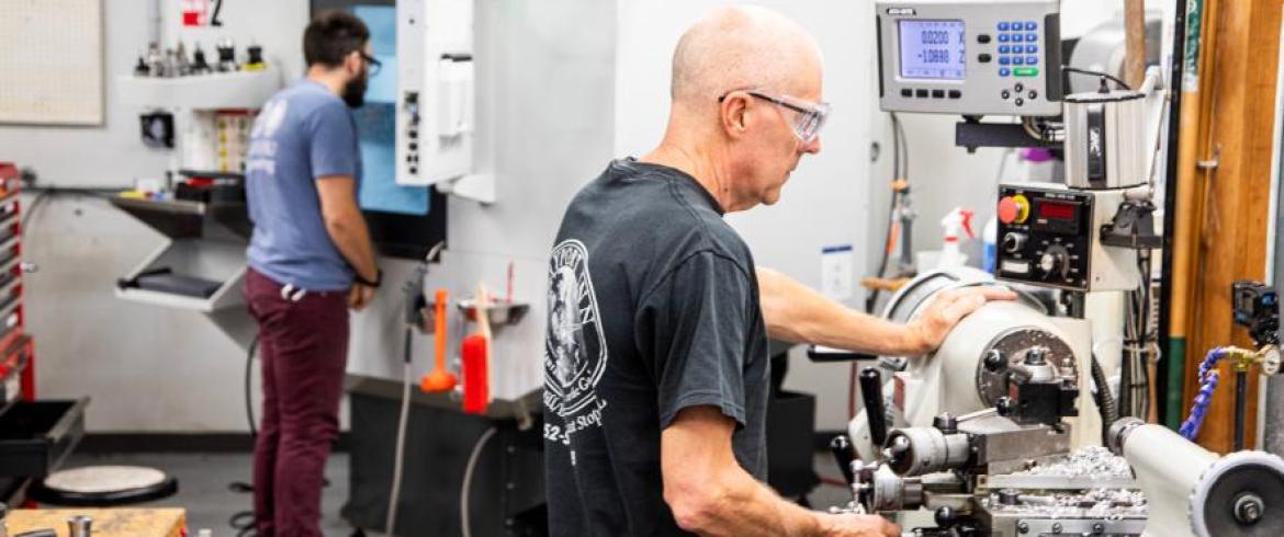 FAMU-FSU College of Engineering machine shop technicians Tom Slade, right, and Justin Pogge work in the machines in building A.