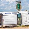 photo of truck overturned on rural highway