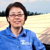 photo of hui helen li in front of a solar array