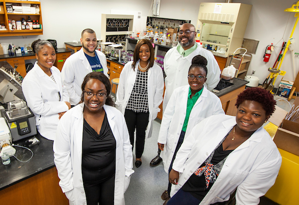 Dr. Clayton Clark and graduate students in research lab