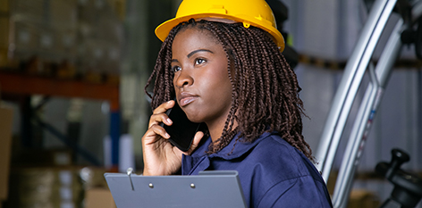 Black female construction manager on a cell phone call
