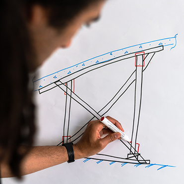 student drawing on a whiteboard