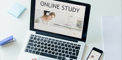 open laptop with words on the screen saying, online study