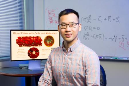 photo of famu-fsu engineering professor leo liu in front of monitor and white board