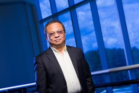 portrait of richard liang at famu-fsu engineering in front of blue window