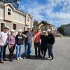 photo of engineering students and faculty in front of demolition site