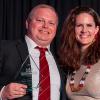 photo of famu-fsu engineering and florida state university alum adam russel accepting the seminole 100 award from marla vickers