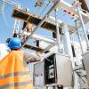 photo of electrical worker at substation