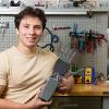 photo Nikolya Cadavid poses with his AI-powered prosthetic hand prototype at FAMU-FSU College of Engineering in Tallahassee, Florida